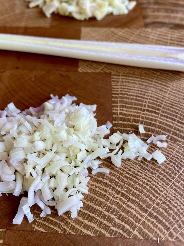 finely minced lemongrass on a cutting board