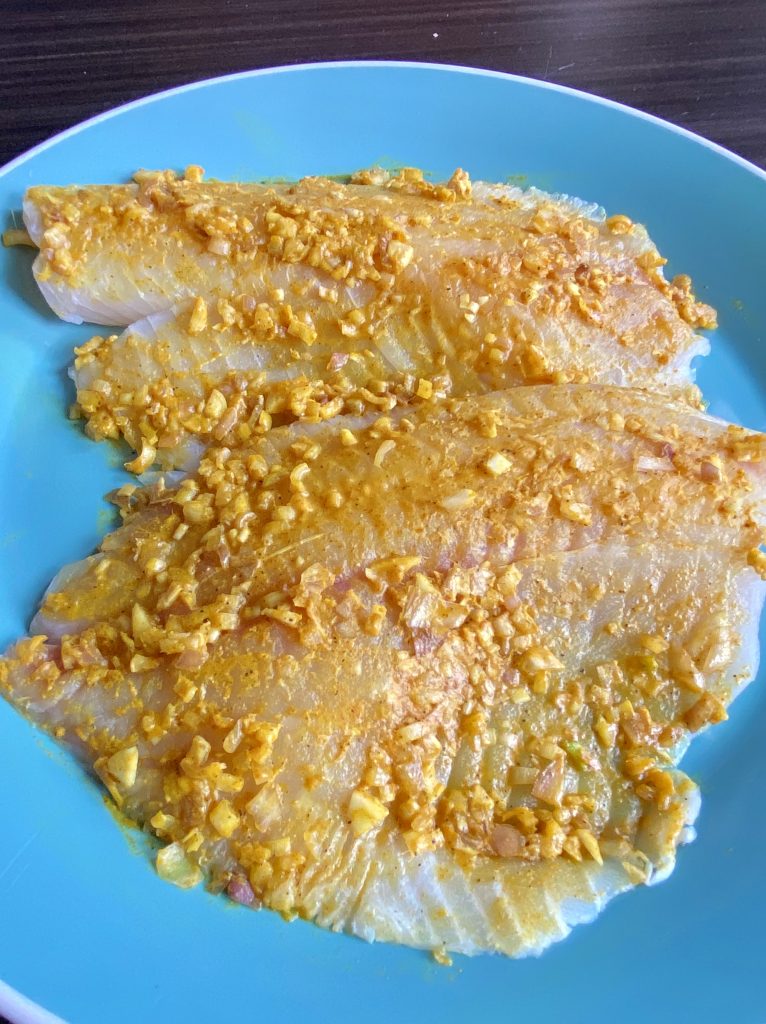 seasoning fish with Vietnamese turmeric and lemongrass marinade