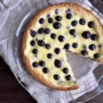Overhead image of Finnish blueberry pie with piece missing